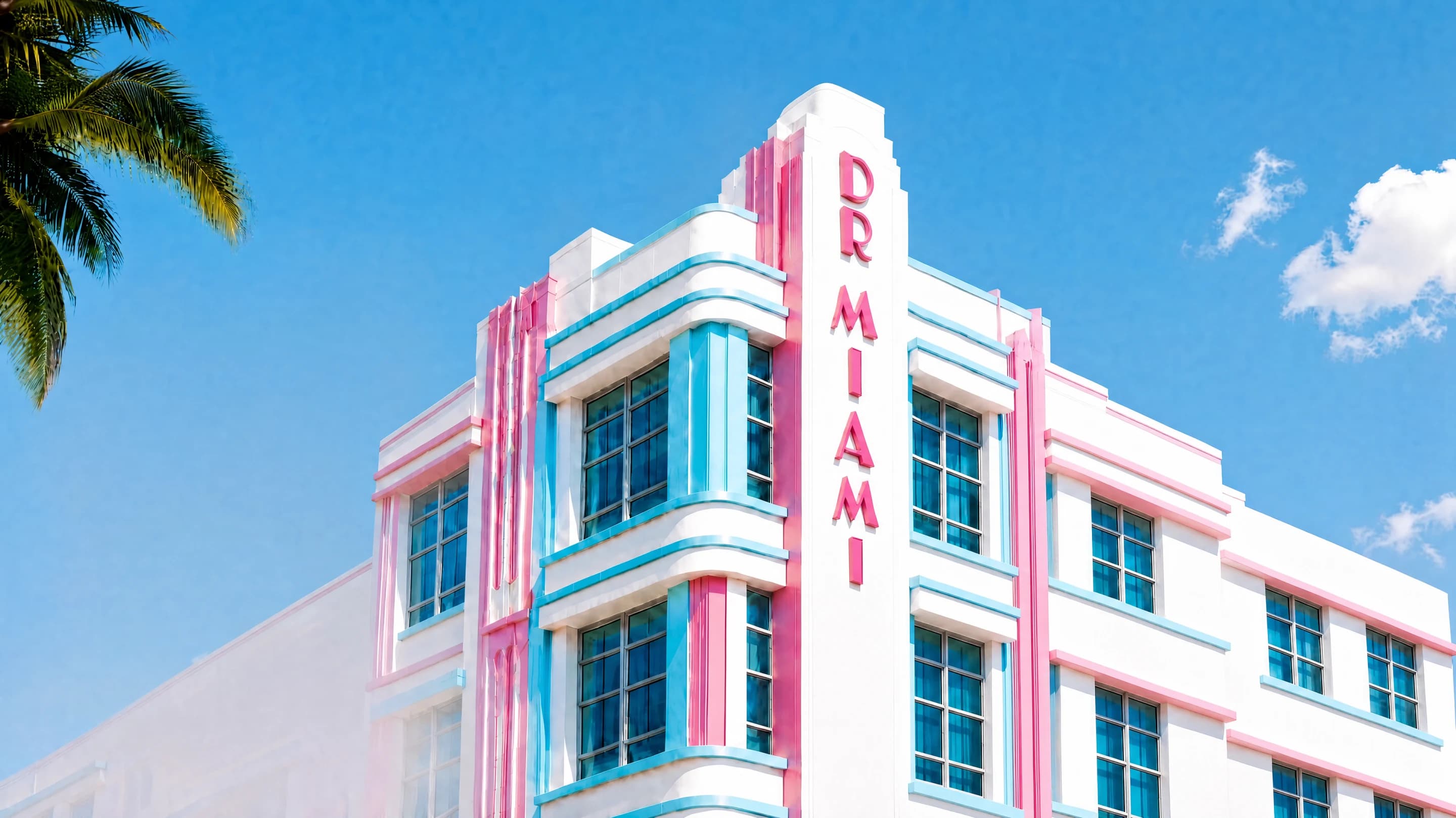 White Art Deco building against a bright blue sky